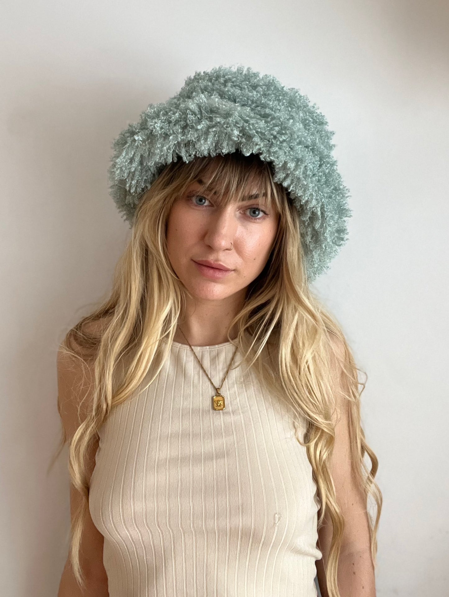 Fuzzy teal bucket hat