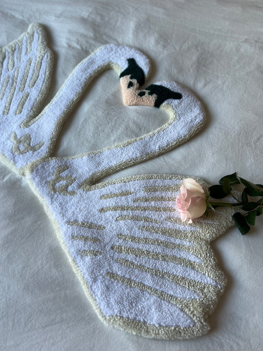 Kissing swans tufted rug